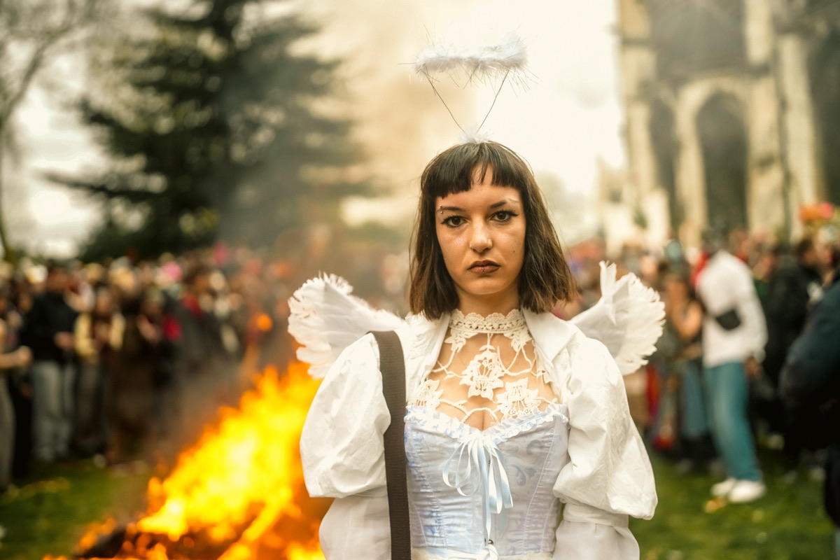 A carnival angel with halo and wings before the bonfire at Rouen cathedral — Carnaval de Rouen